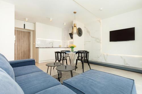 TV a/nebo společenská místnost v ubytování Apartament Klifowa z widokiem na morze i basenem