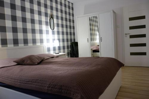 Posteľ alebo postele v izbe v ubytovaní Apartament Solna 106
