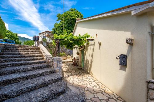 a set of stairs next to a building at Villa Chiara in Brseč