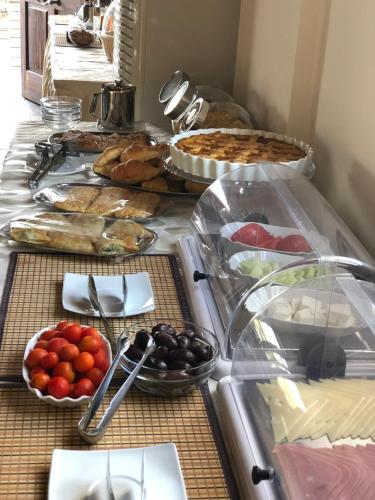a buffet with many different types of food on it at So Nice Hotel in Marathokampos