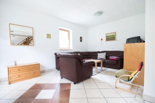 a living room with a couch and a table at Yellow house in Trenta
