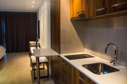 Kuchyň nebo kuchyňský kout v ubytování Palm Aparthotel