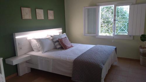 מיטה או מיטות בחדר ב-Olive garden guest house