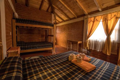 Postel nebo postele na pokoji v ubytování Hostal el Vaquero
