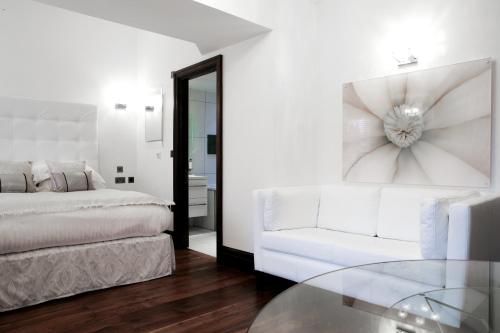 Katil atau katil-katil dalam bilik di Windermere Suites