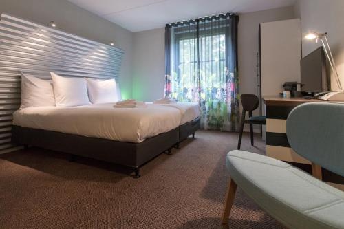 Postel nebo postele na pokoji v ubytování Hotel Kapellerput Heeze-Eindhoven