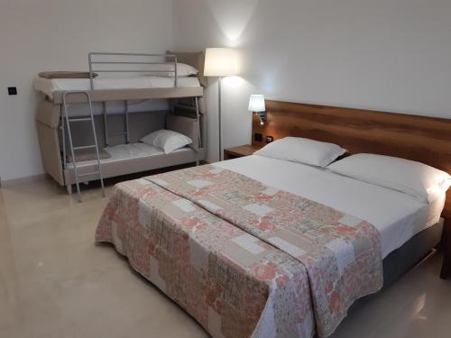 Postel nebo postele na pokoji v ubytování Morello Beach Hotel