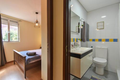 a bathroom with a toilet and a sink at Clerigos Old Town Apartment in Porto