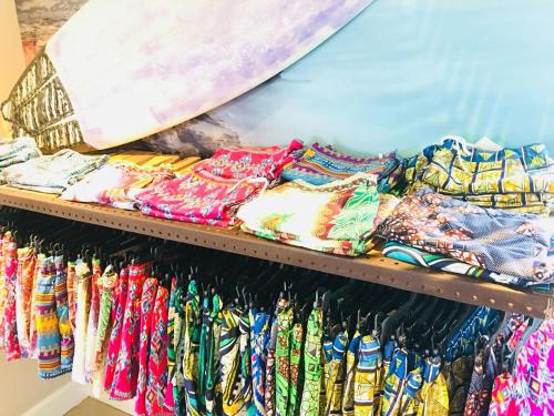 a shelf filled with lots of different colored ties at The Glen Boutique Hotel & Spa in Cape Town