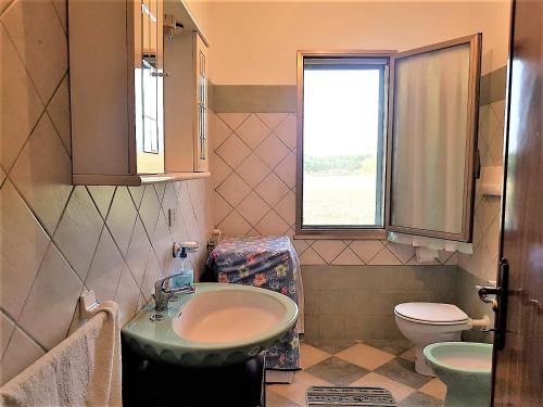 Een badkamer bij Villetta Su Barrali