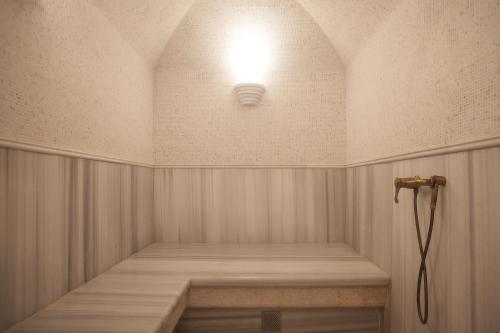 a room with a light on the ceiling at Ribas Duke Boutique Hotel in Odesa