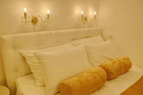 a white bed with a croissant on top of it at Villa Madonna della Strada A1 in Dubrovnik