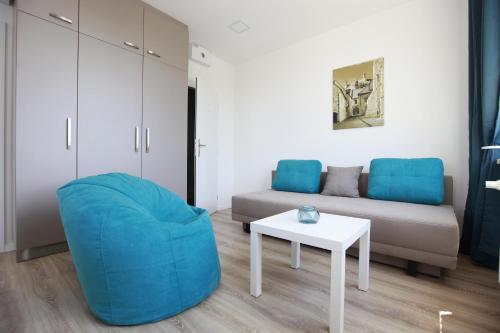 a living room filled with furniture and a couch at City Center Best Place Apartments in Bratislava