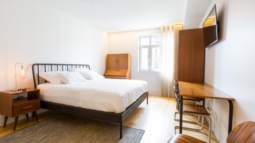 Un pat sau paturi într-o cameră la Braga Heritage Lofts