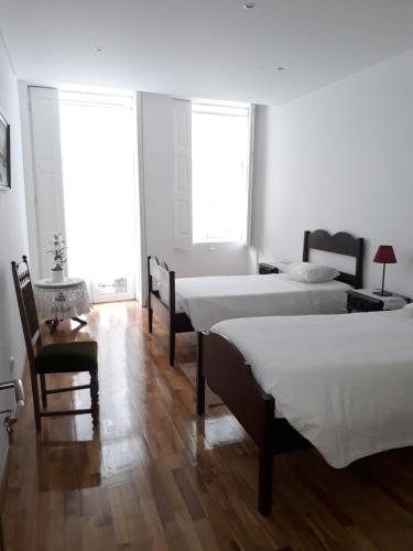 A bed or beds in a room at Myosotis Oporto