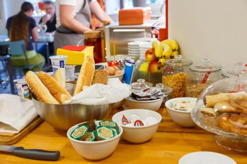 a table topped with bowls of food on a counter at Hotel & Depandance Kopacka in Lanškroun