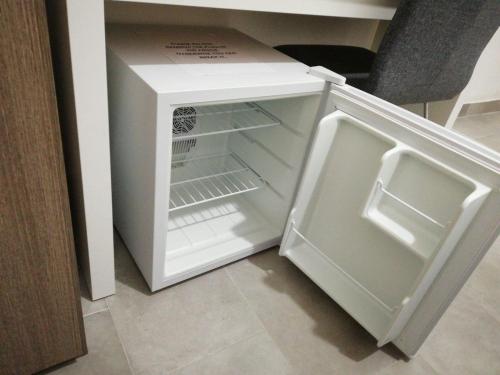 A kitchen or kitchenette at Grandis Rooms