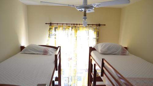 Tempat tidur dalam kamar di Residencial Doce Marina