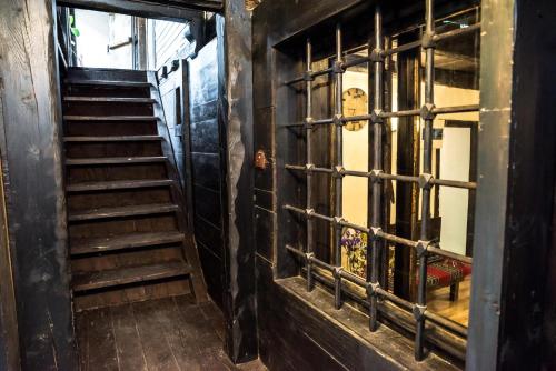 an empty room with stairs and a window at Banskovilla Zlateva House in Bansko
