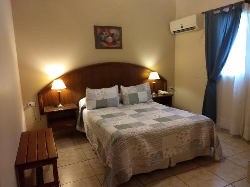 Ένα ή περισσότερα κρεβάτια σε δωμάτιο στο Hotel Suma Huasi