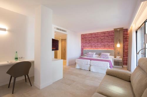 Hotel Bella Playa & Spaにあるベッド
