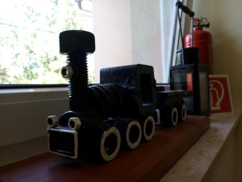 a toy dump truck sitting on a table at Sorompó Vendégház in Balatonkenese