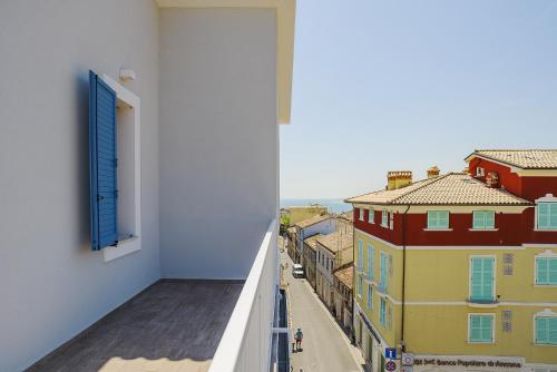 a view from a balcony of a building with a window at Viverenumana appartamenti la tua casa in centro a pochi passi dal mare in Numana