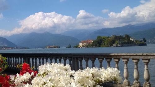 a balcony with a view of a lake and mountains at Danilo Apartments in Baveno