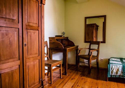 a room with a desk and a chair and a mirror at Lublin Apartaments in Lublin