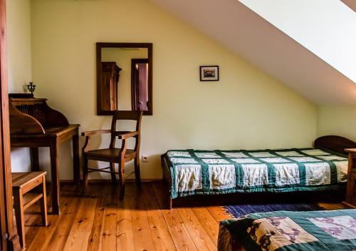 a bedroom with a bed and a mirror and a piano at Lublin Apartaments in Lublin