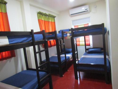 Ένα ή περισσότερα κρεβάτια σε δωμάτιο στο Kandy Backpackers Hostel