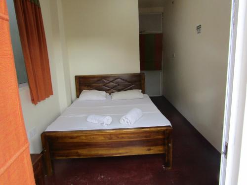 Ένα ή περισσότερα κρεβάτια σε δωμάτιο στο Kandy Backpackers Hostel