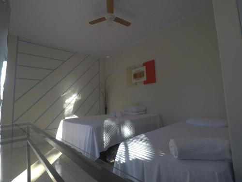
A bed or beds in a room at Mambaí Inn
