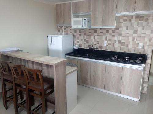 Kuchyň nebo kuchyňský kout v ubytování Residencial Correa Pereira
