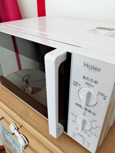 a white microwave oven sitting on top of a drawer at Nikko Park Lodge Tobu Station in Nikko