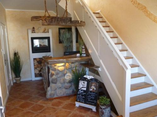 a staircase in a home with a stair case at Haus Strandperle in Dahme