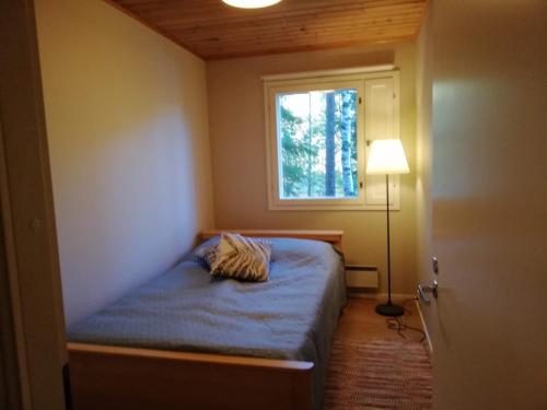 Postel nebo postele na pokoji v ubytování Tikkamäki