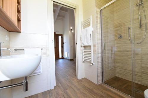a bathroom with a sink and a shower at La Cerqua in Arcevia
