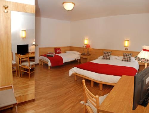 Een bed of bedden in een kamer bij Albergo Centrale