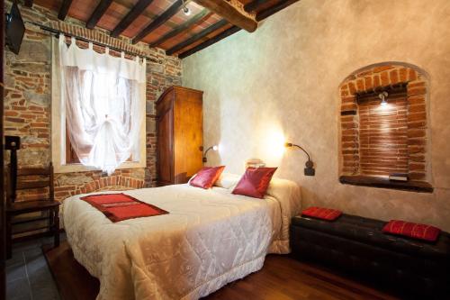a bedroom with a large bed and a window at Tangohotel in Lucca