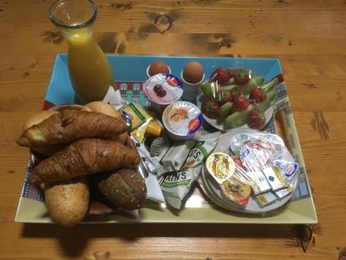 a tray of food with bread and vegetables on a table at Amsterdam House of Arts & Crafts in Amsterdam