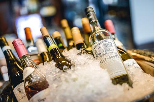 a bunch of wine bottles in a bucket of snow at Clarion Hotel Malmö Live in Malmö