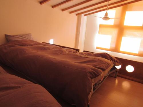 Ένα ή περισσότερα κρεβάτια σε δωμάτιο στο Lodge Nakajima