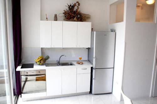 A kitchen or kitchenette at Apartments Prestige