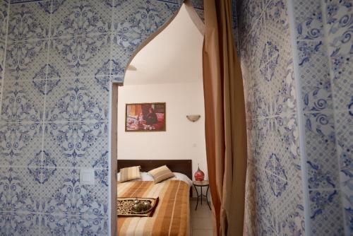 Una cama o camas en una habitación de L'Acilya