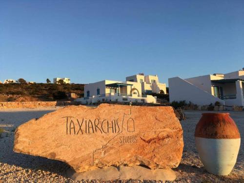 a rock with the word karapairs written on it at Taxiarchis Studios in Áyios Yeóryios