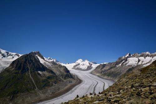 a view of a mountain road in the mountains at Appartmenthaus Bergfreund in Fiesch