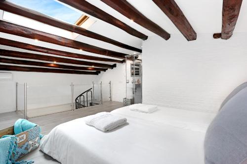 A bed or beds in a room at Gracia 1872