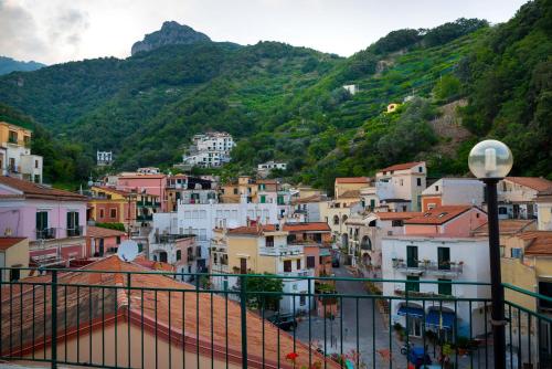a view of a town with mountains in the background at 'A Regina b&b Cetara in Cetara