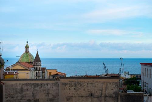 a view of a city with the ocean in the background at 'A Regina b&b Cetara in Cetara